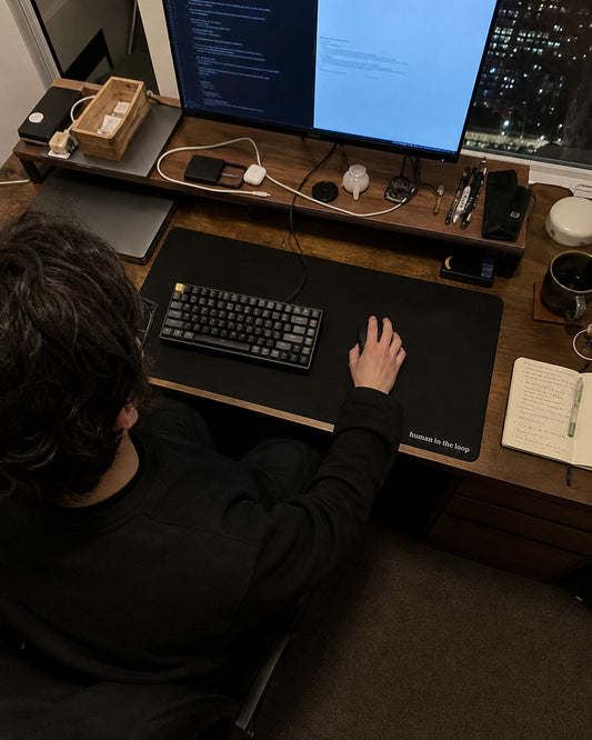 Human in the Loop Desk Mat, worn and used